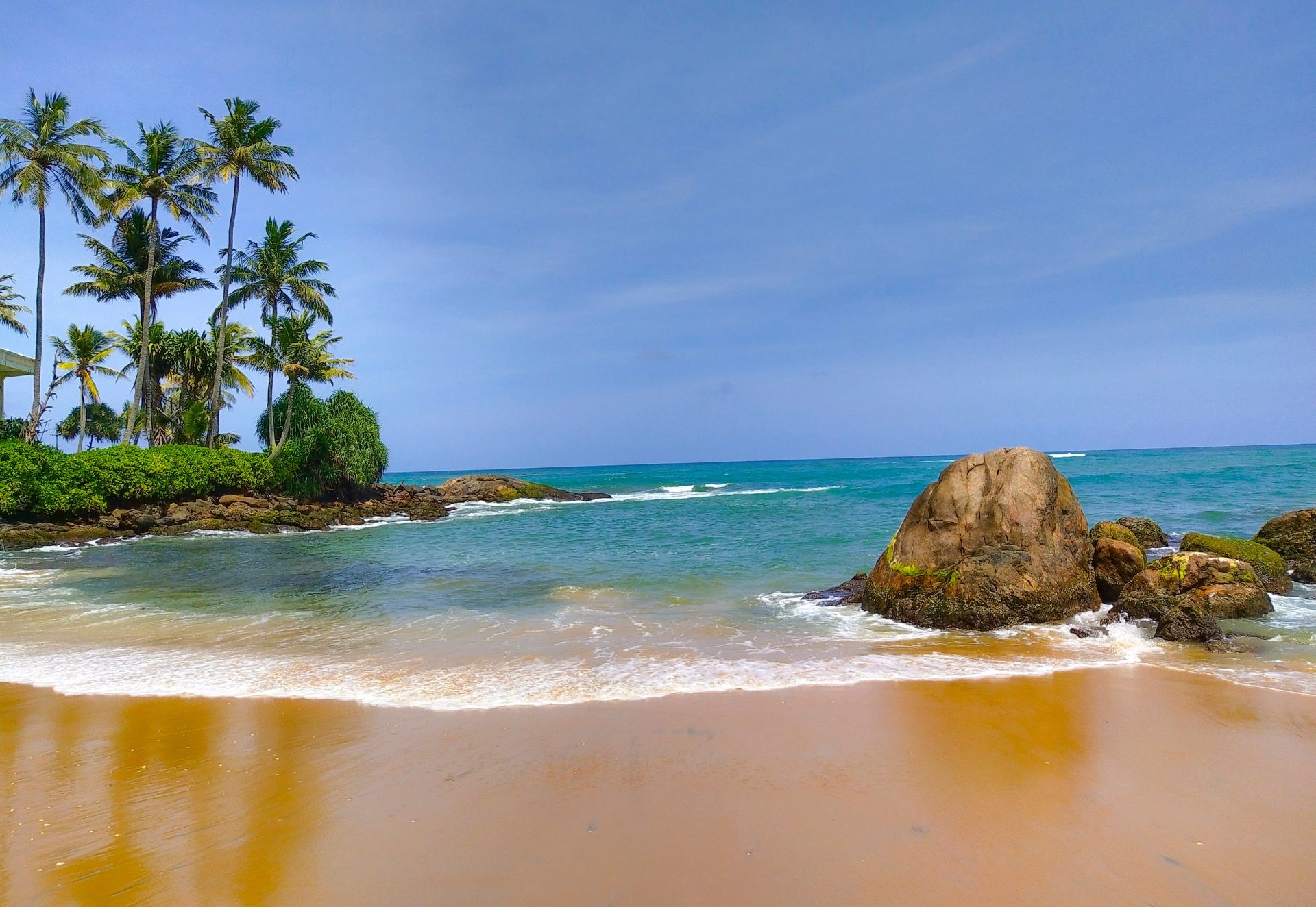 brown rock formation on sea shore during daytime